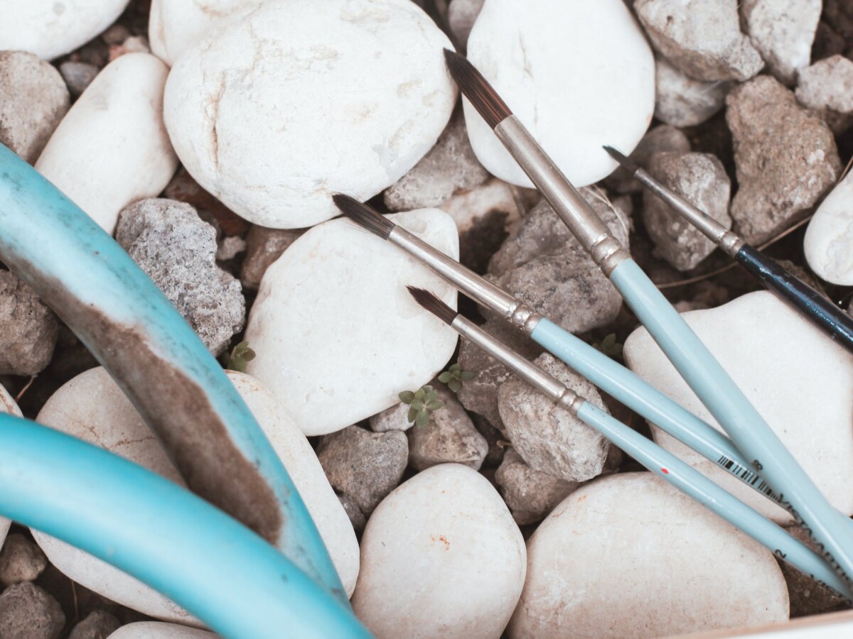 paint brushes on rocks
